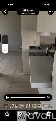 A kitchen with a sink and a counter.