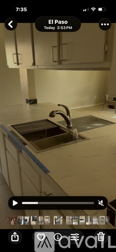A kitchen with a sink and a countertop.
