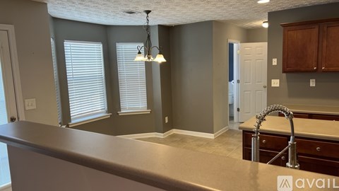 A kitchen with a countertop and a sink.