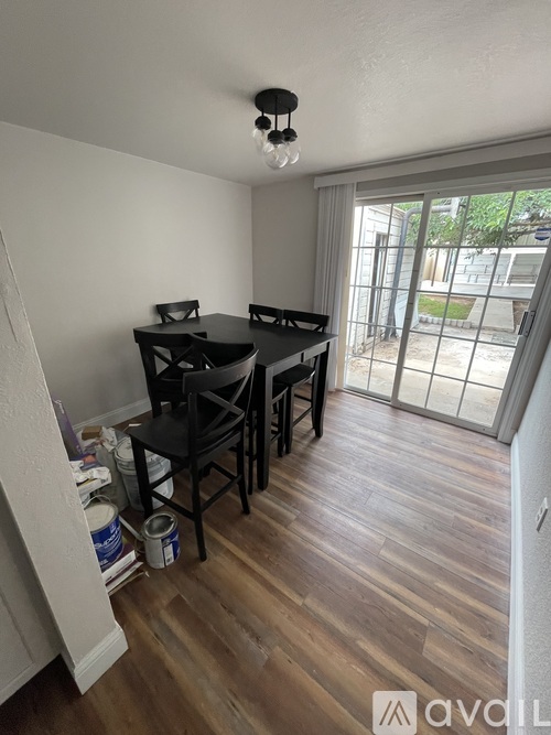 A room with a table and chairs in it.