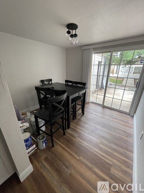 A room with a table and chairs in it.