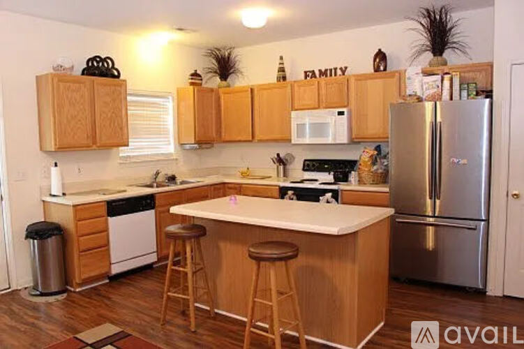 A kitchen with wooden cabinets and a white countertop.