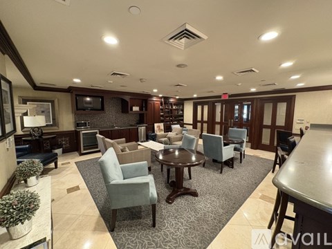 A living room with a dining table and chairs.