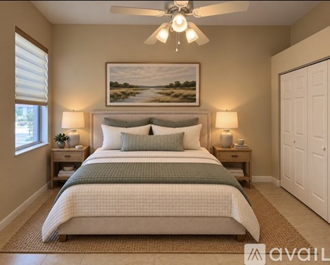 A bedroom with a large bed and a painting on the wall.