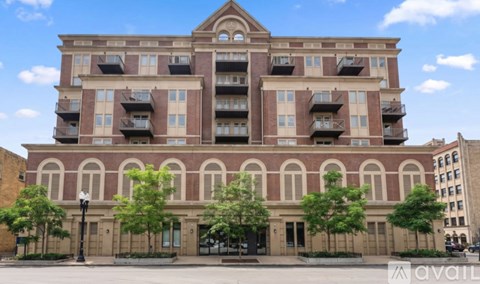 A large building with a balcony on the second floor.