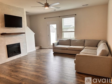 A living room with a fireplace and a couch.