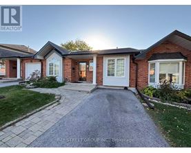 A house with a driveway in front of it.