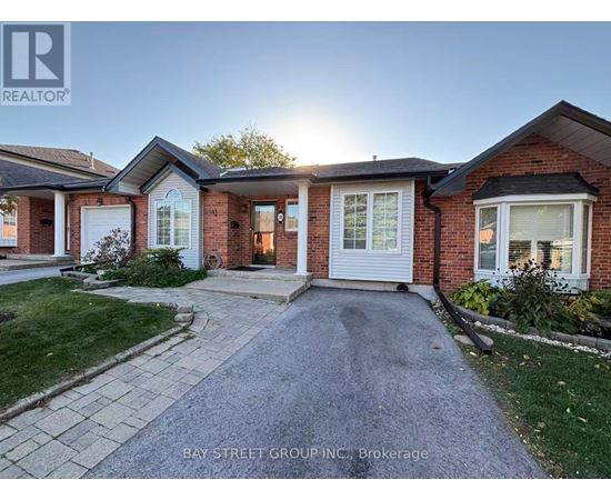 A house with a driveway in front of it.