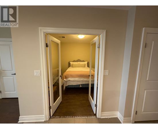 A bedroom with a bed in the middle of the room.
