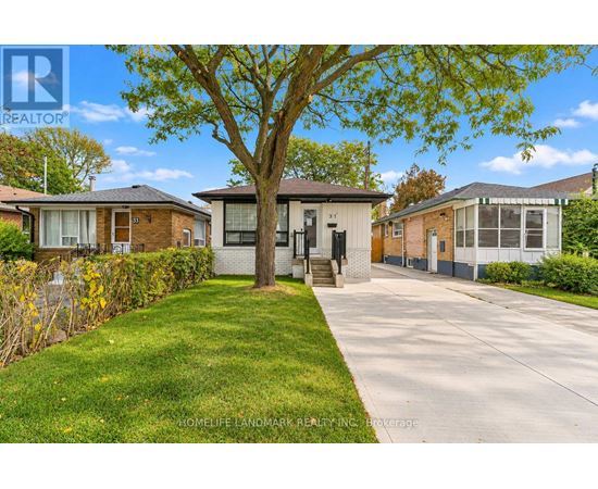 A tree in front of a house with a sign that says "HomeLife Landmark Realty, Inc. Brokerage".