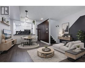 A modern living room with a kitchen area in the background.