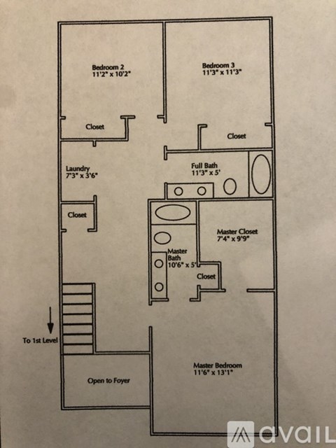A floor plan of a house with two bedrooms, a laundry room, a full bath, a master closet, and an open foyer.
