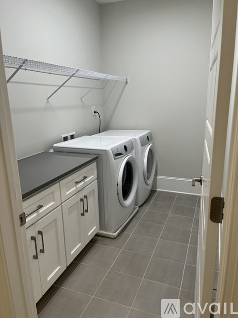 A laundry room with a washer and dryer.