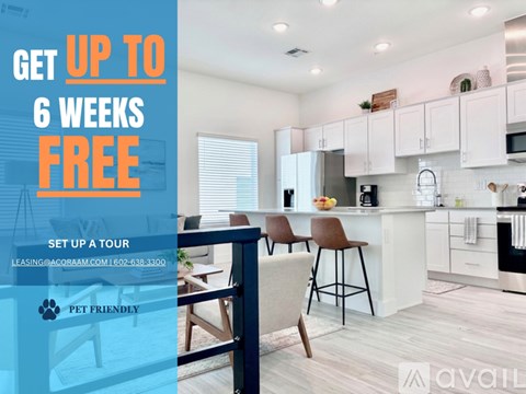 A living room with a couch, chair, and a coffee table with a sign offering a free first month of rent.