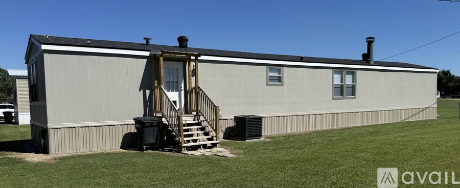 A house with a porch and a covered entrance.
