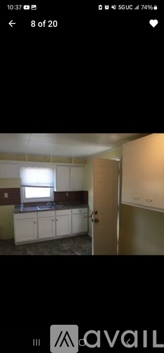 A room with a window and a door is shown.