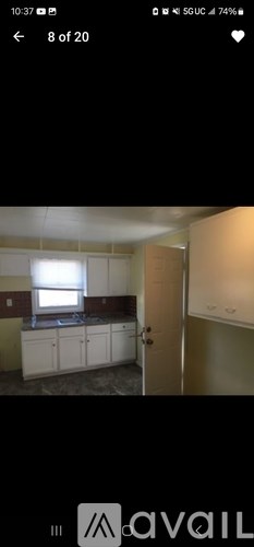 A room with a window and a door is shown.