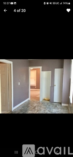 A room with a doorway leading to another room.