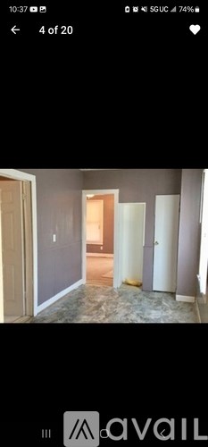 A room with a doorway leading to another room.