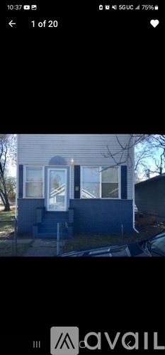 A house with a blue exterior and a white door.