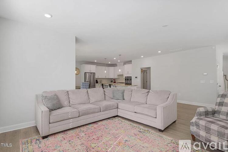 A living room with a couch and a chair.