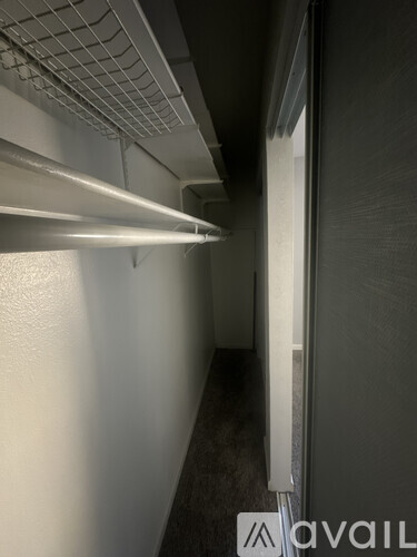 A long hallway with a light on the left side.