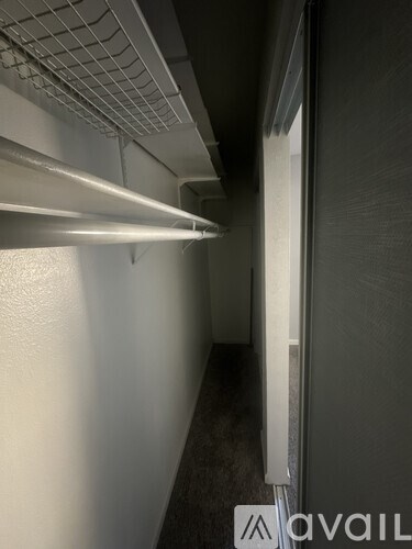 A long hallway with a light on the left side.