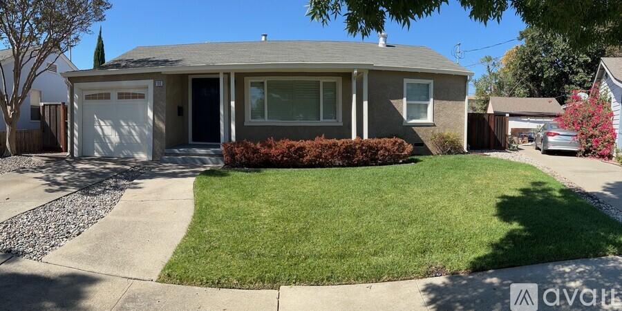 A house with a white garage door is for sale.