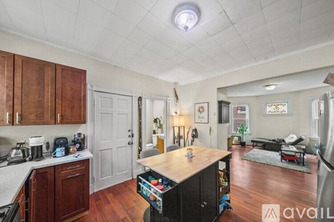A kitchen with wooden cabinets and a white countertop.