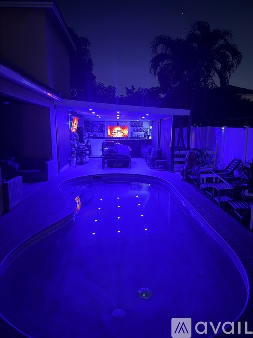 A pool with lights in the middle of it.