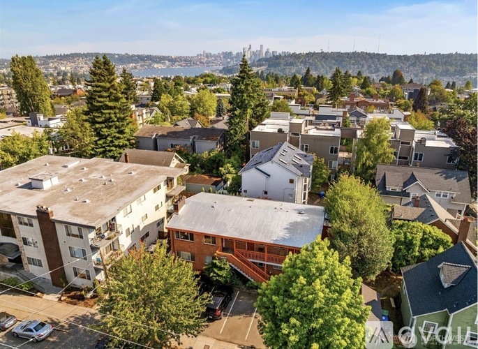 A residential area with houses and trees.