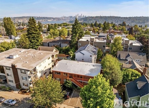 A residential area with houses and trees.