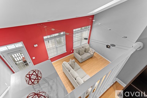 A living room with a couch and a chair.