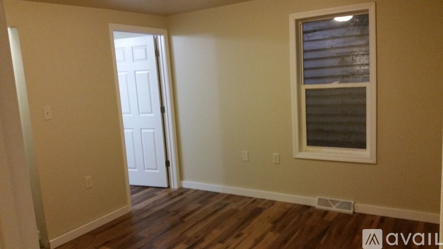 A room with a door and a window.