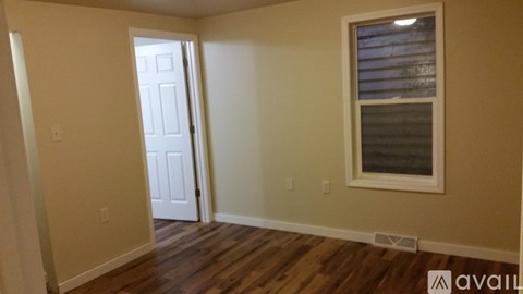 A room with a door and a window.