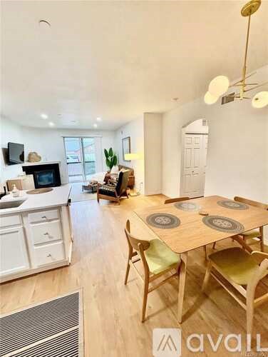 A dining area with a table and chairs.
