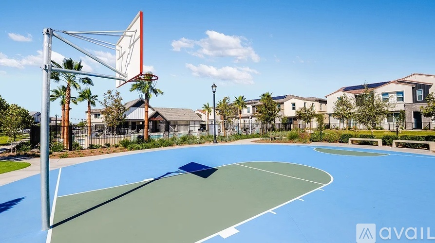 A basketball court with a hoop and a sign that says "available".