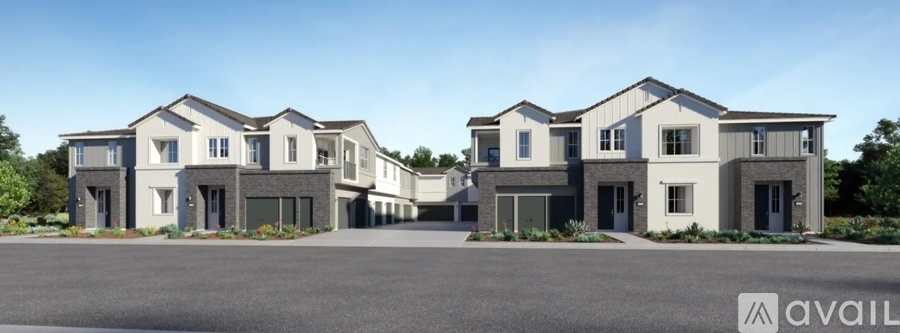 A row of modern houses are available for purchase.