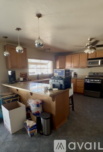 A kitchen with a box on the counter.