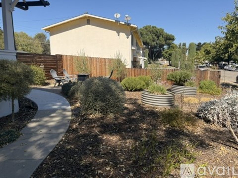 A house with a garden in front of it.