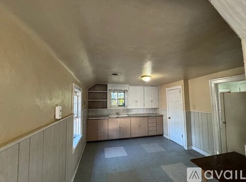 A kitchen with a sink and cabinets is available for rent.