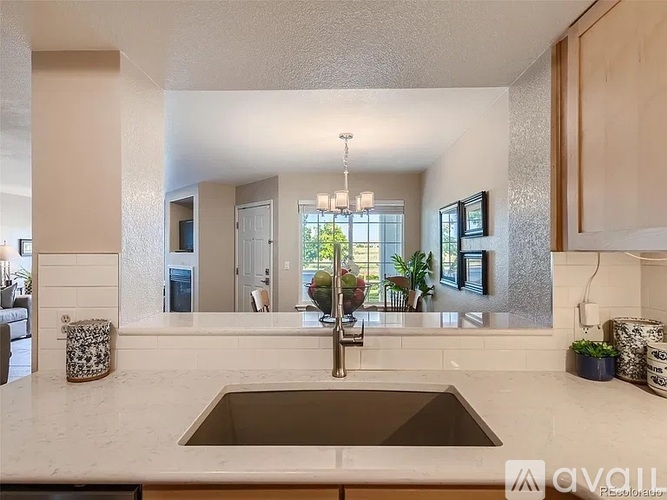 A modern kitchen with a large island and a sink.