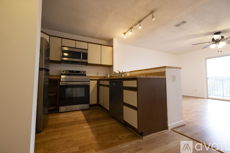 A kitchen with wooden floors and a large island.