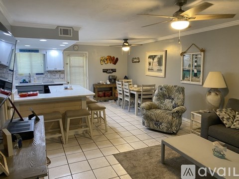 A kitchen with a dining table and chairs.