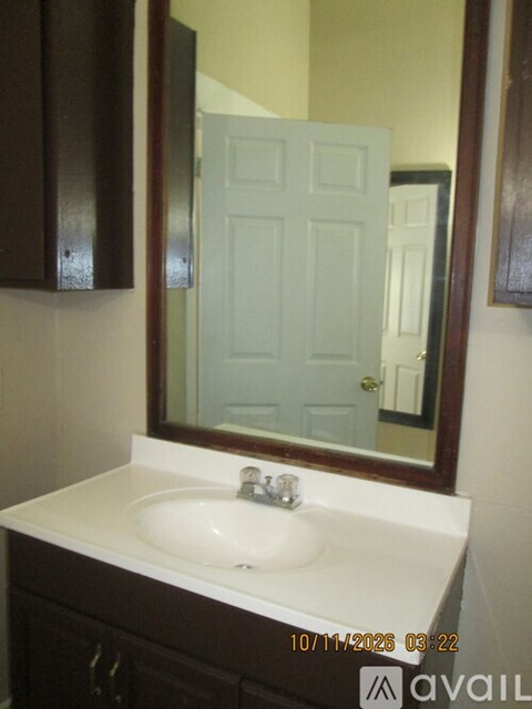 A bathroom sink with a mirror above it.