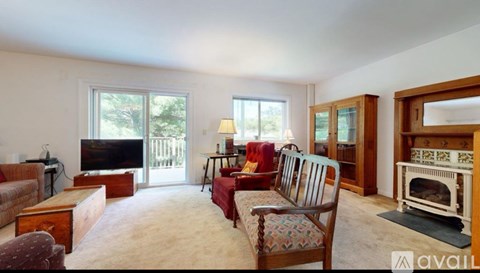 A living room with a fireplace and a couch.