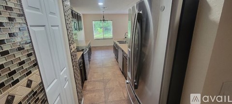 A kitchen with a washer and dryer built in.