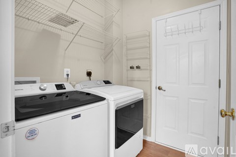 A white kitchen with a stove and oven.