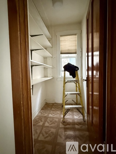 A ladder is leaning against a wall in a room.