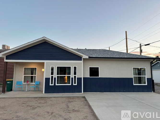 A house with a blue and white exterior is available for rent.